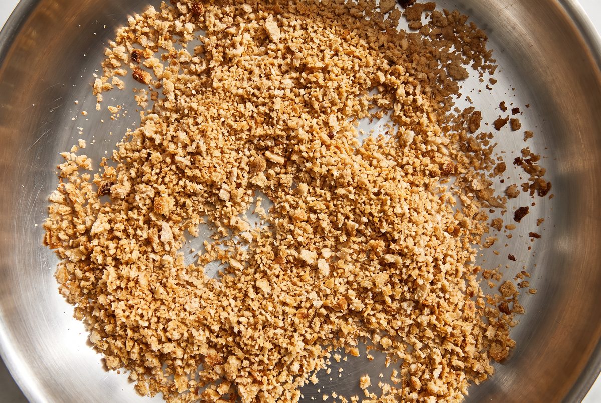 Coarse whole-wheat breadcrumbs toasted to the color of wet sand in a small stainless-steel pan